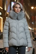 Купить Куртка зимняя женская с мехом и капюшоном тренд светло-зеленого цвета 7759ZS